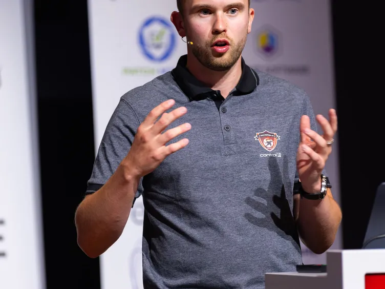 Florian Salzmann speaking on stage at Workplace Ninja Summit 2025